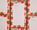 A close-up of a printed grocery list pad with a pink strawberry border, laid over a woven brown basket or mat. Multiple copies of the pad are visible in a repeating pattern. Linocut Design