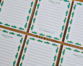 A close-up of several white to-do list cards arranged in a grid on a brown woven mat. Each card has a green fish border, orange dots, and the text 'TODAY'S TO-DO' and 'hopefully'. Linocut Design