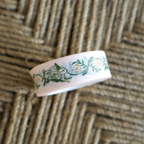 roll of bunny and floral themed washi tape for stationery from an original linocut design