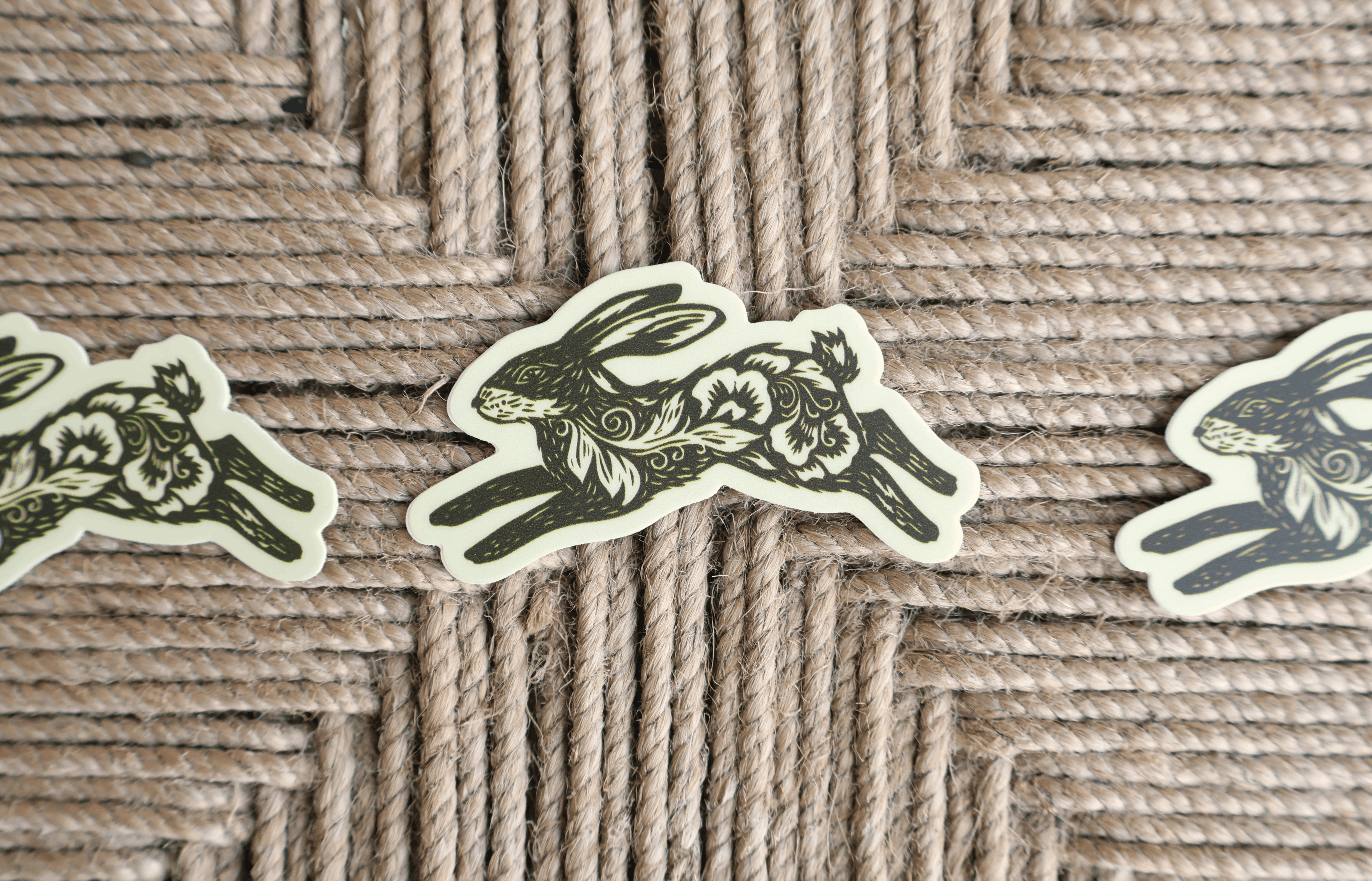 bunny linocut sticker on brown background