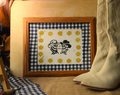 cowboy skulls smoking with stars and gingham mat with wood frame with western boots