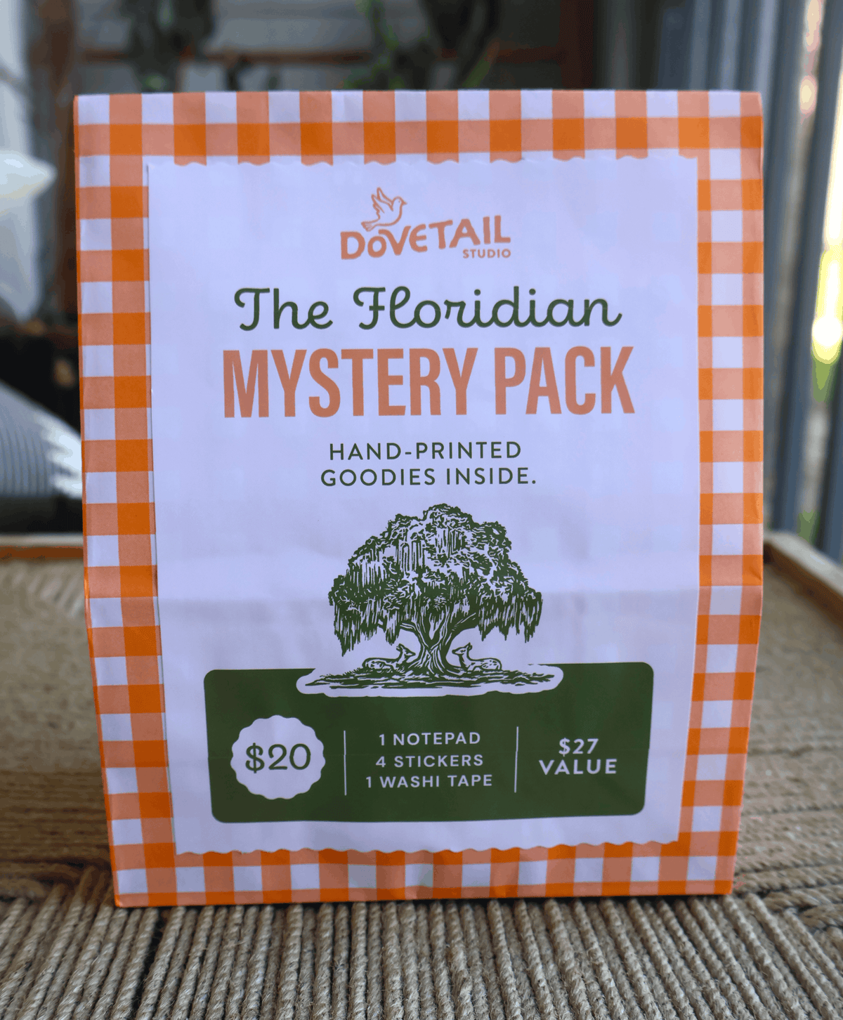 floridian linocut mystery pack green and orange on brown woven background table