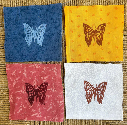 butterfly cotton fabric sew on patches blue on blue, red on red, brown on yellow, ad brown on white patterned fabric handmade linocut prints on a textured brown background