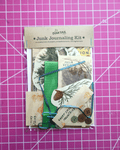vintage theme Junk Journaling Kit by Dave Tail on a pink grid background nature, plants, and travel