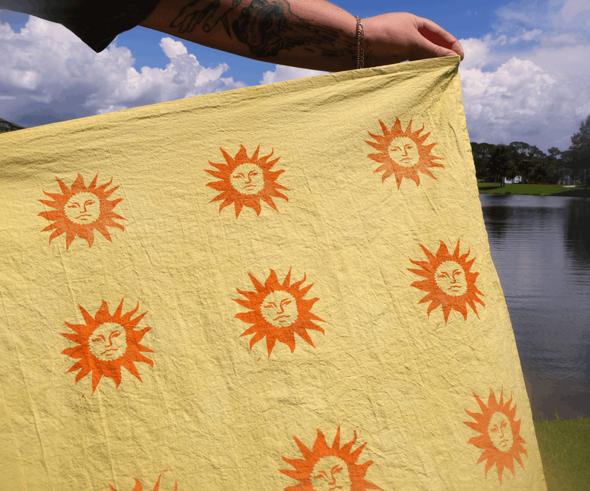 sunshine linocut yellow teatowel outside